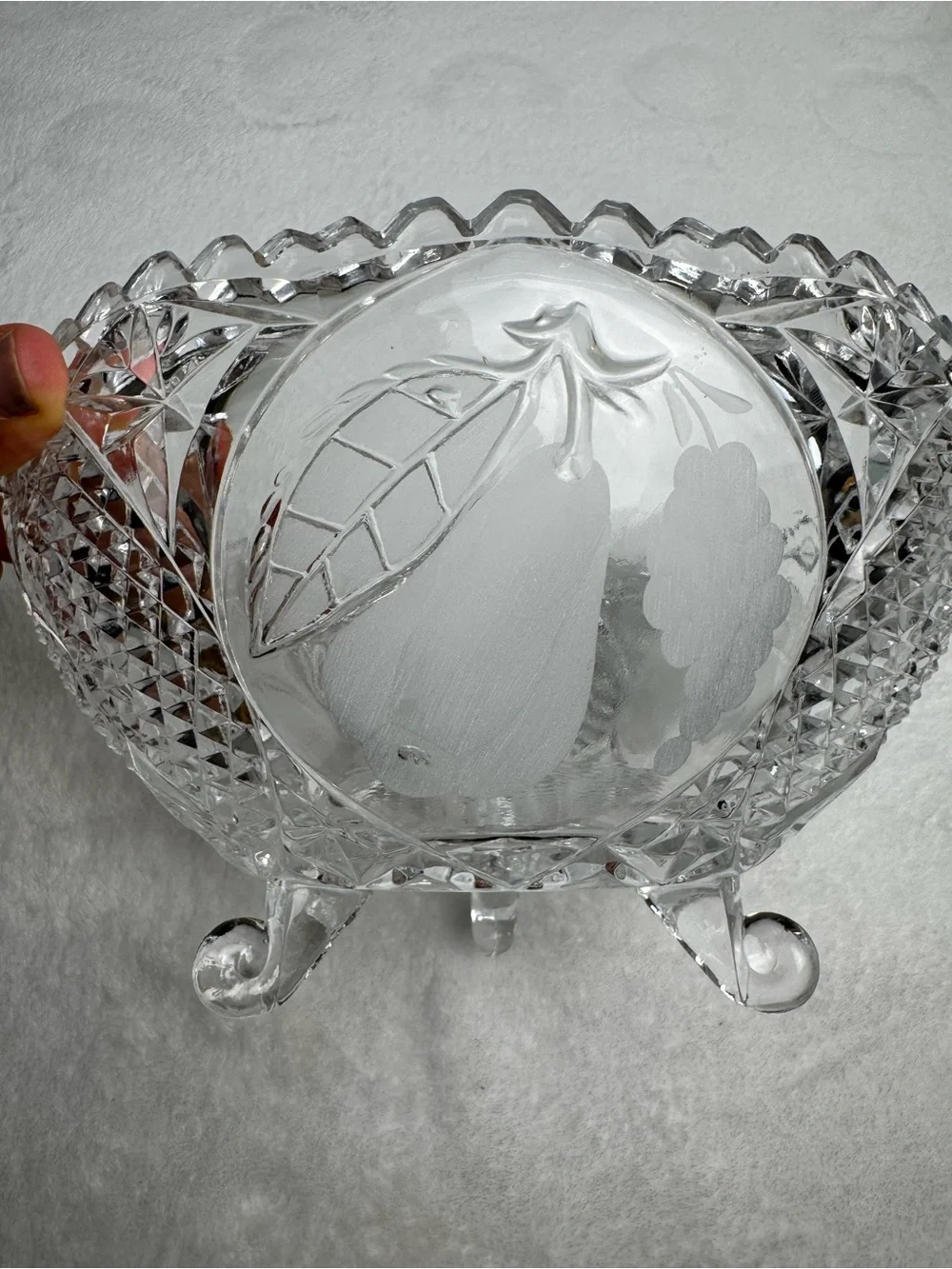 This vintage crystal cut and pressed pear and grape etched footed bowl 8.5”